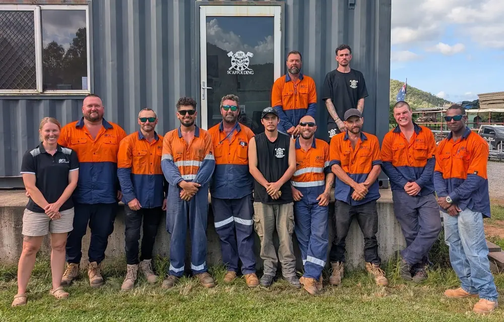 T & T Scaffolding team standing together outside their workplace