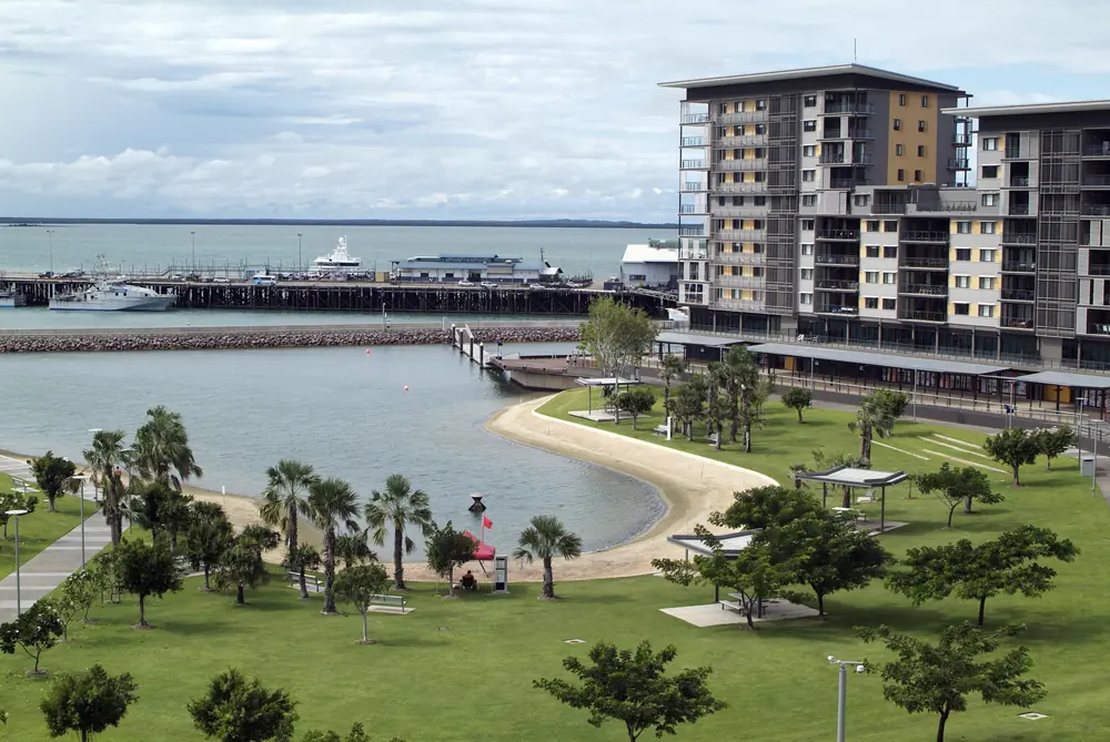 Waterfront park and apartment buildings beside a harbour