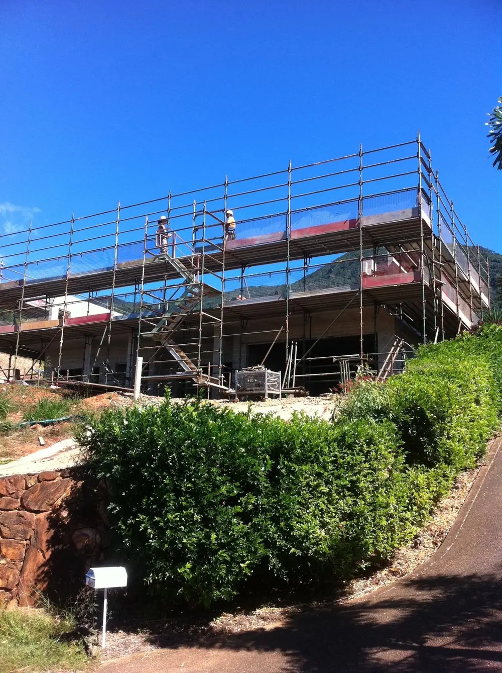 Scaffolding erected along a building on a sunny worksite